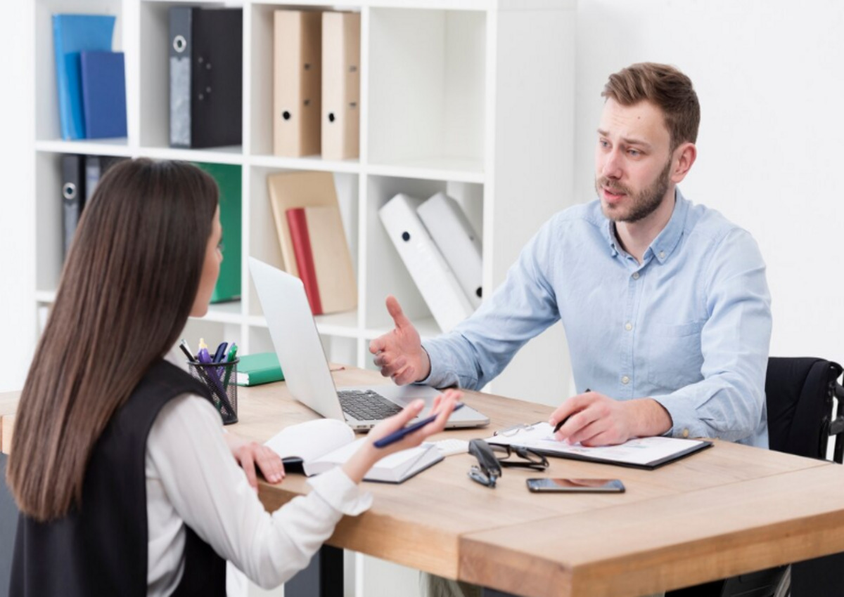 An IRS auditor interviewing the employees of the audit business establishment