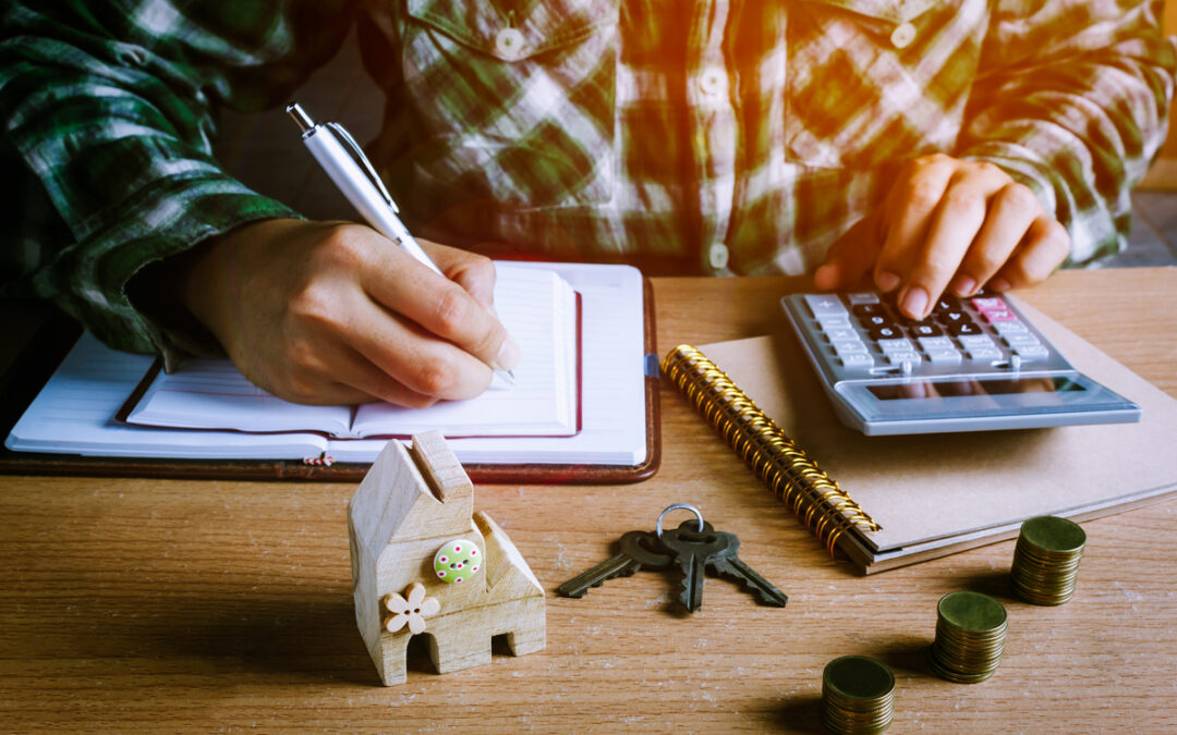 A man doing a computation of his real property tax.