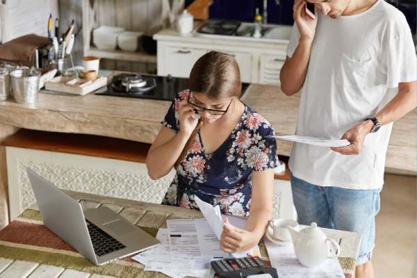 couple managing tax audit in kitchen