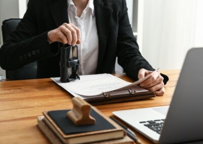 Lawyer stamping documents.