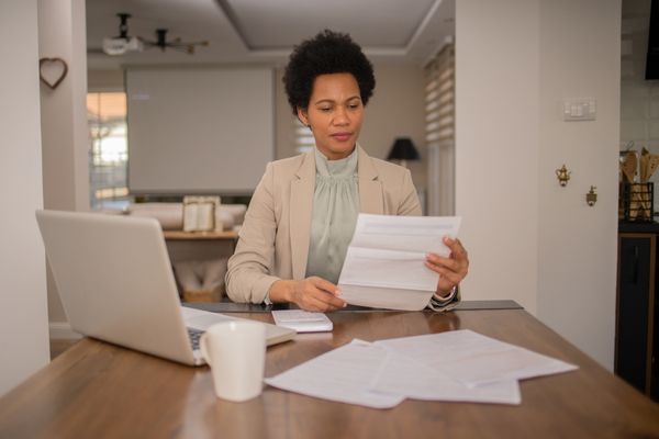 Female reviewing personal tax forms