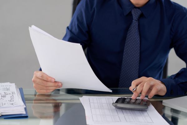 Man completing tax settlement process
