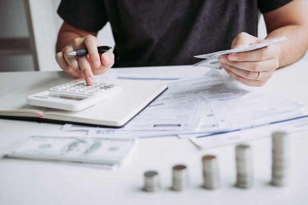 Man computing his tax payment