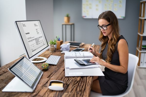 Woman settling complete outstanding tax payment