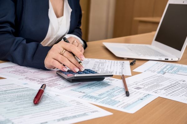 Woman using dashboard for tax tracking
