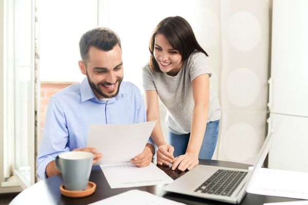 Couple organizing future tax returns timely