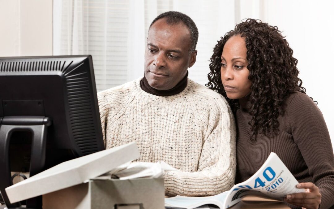 Business owners doing tax preparation together.
