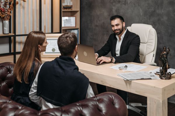 Business owners consulting with a tax lawyer.