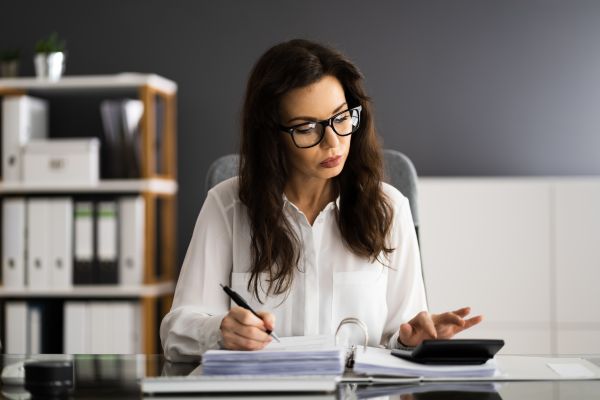 Accountant calculating sale tax invoice.