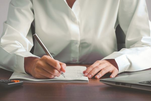 Businessman reviewing documents for IRS compliance