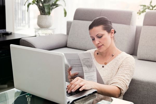 Woman organizing tax returns at desk