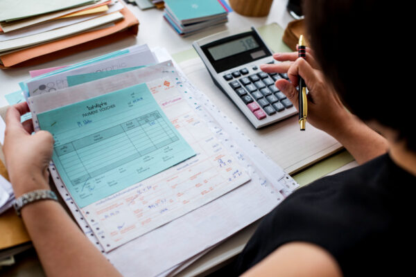 Woman preparing tax manually