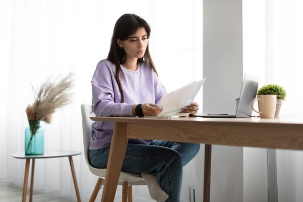 Woman receiving official IRS tax notice