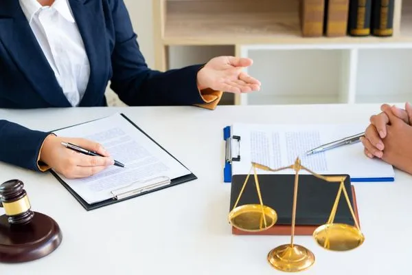 Man consulting attorney about wage garnishment