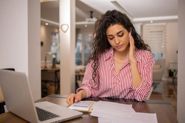 Woman holding unexpected tax transcript letter