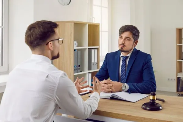 Man consulting professional tax resolution expert