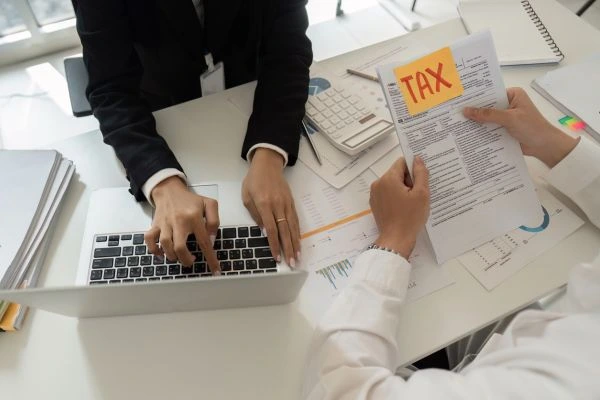 Woman seeking help from tax specialist