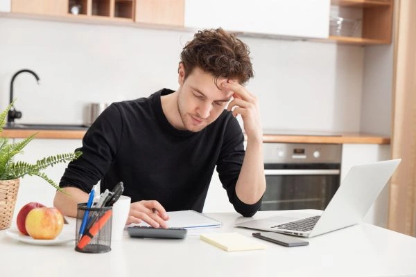 Person reviewing unemployment income tax documents