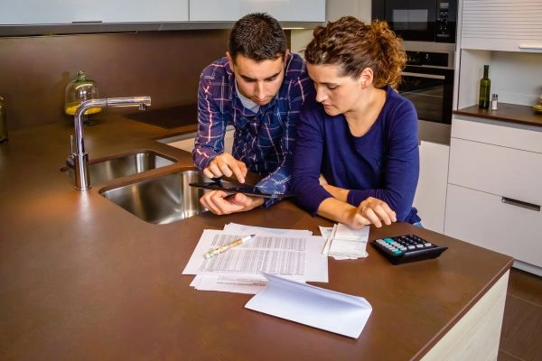 Couple looking through their joint bank account