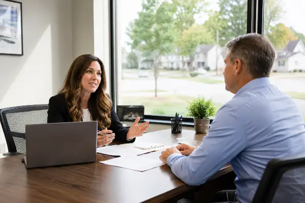 Tax professional meeting a client about Michigan state back taxes